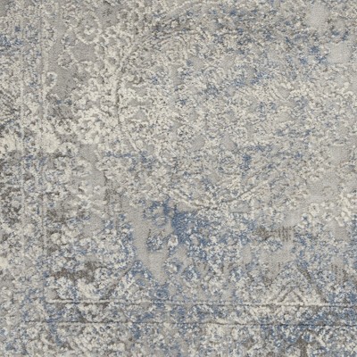 Ivory Elegance 5'3" x 7'3" Synthetic Vintage Persian Rug