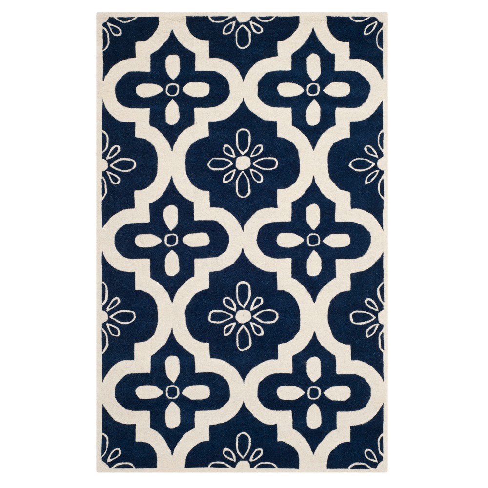 Dark Blue/Ivory Quatrefoil Design Tufted Accent Rug 4'x6' - Safavieh