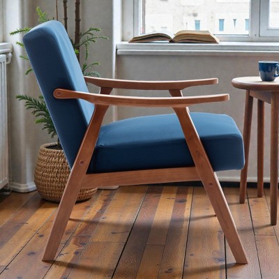 Blue upholstered lounge chair with wooden frame viewed from side