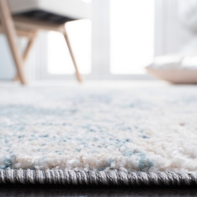 Ivory and Blue Abstract Synthetic Area Rug, 3' x 5'
