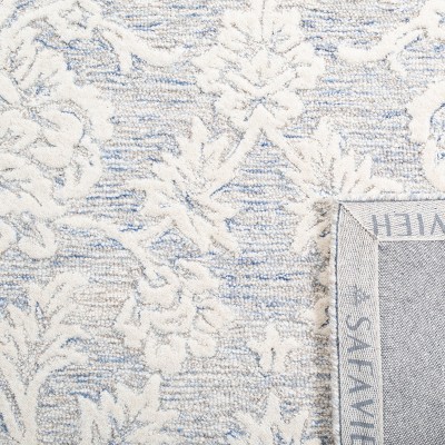 Blue and Ivory Hand-Tufted Wool 4' x 6' Area Rug