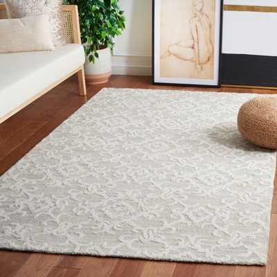 Handmade Off-White Floral Wool Rectangular Area Rug