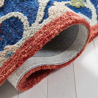 Handmade Blue and Rust Wool Tufted Area Rug 4' x 6'