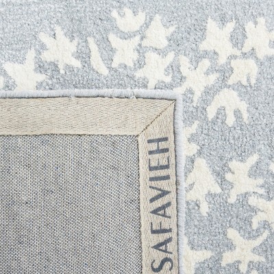 Handmade Light Blue and Ivory Wool Tufted Area Rug