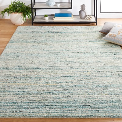 Ivory and Turquoise Handwoven Wool Shag Area Rug, 5' x 8'