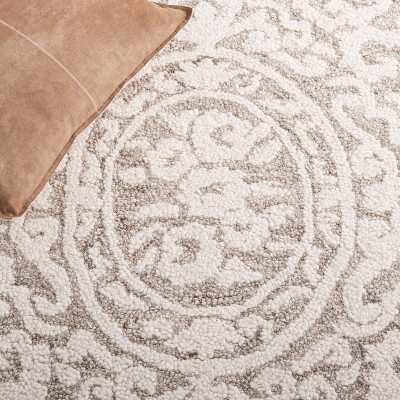 Handmade Ivory Abstract Tufted Wool Round Rug