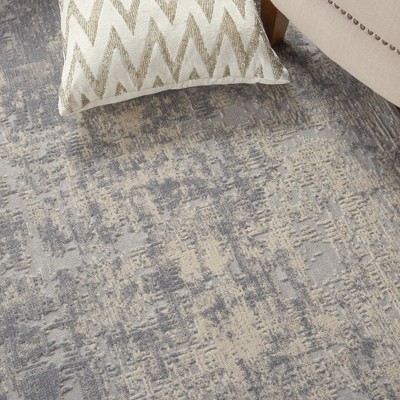 Ivory Abstract Power-Loomed Synthetic 5'3" x 7'3" Area Rug