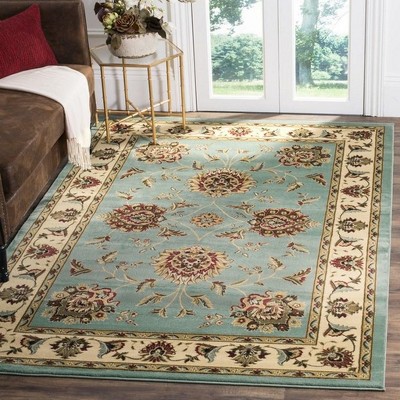 Ivory and Blue Floral Synthetic 4' x 6' Rectangular Rug