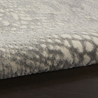 Ivory and Grey 5' x 7' Animal Print Synthetic Area Rug