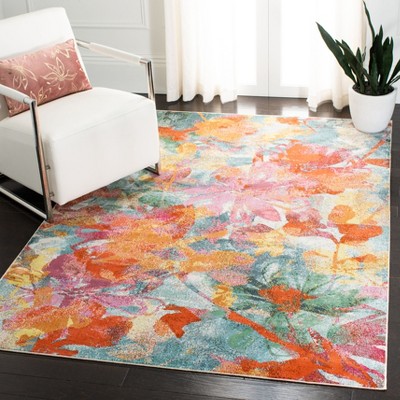 Lillian Blue and Orange Floral Synthetic Area Rug