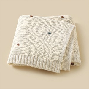 MyKids-USA Hot Selling Knitted Solid Color Baby Blanket With Hand-Embroidered Pom Poms: Spring/Summer Collection - 1 of 3