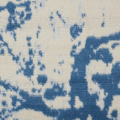 Ivory and Blue Abstract Synthetic 2' x 4' Easy-Care Area Rug