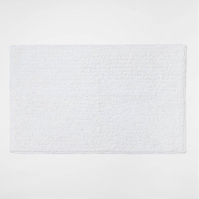 20"x34" Performance Texture Solid Accent Bath Rug White - Threshold™