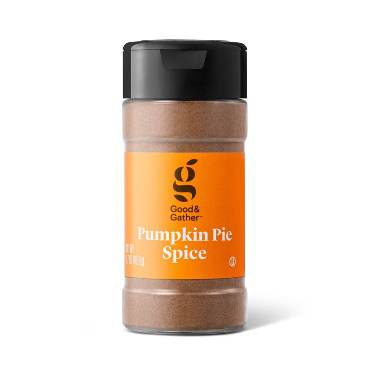 A clear plastic jar with a black lid containing brown colored pumpkin pie spice, labeled "Good & Gather Pumpkin Pie Spice NET WT 1.7 OZ (48.2g)."