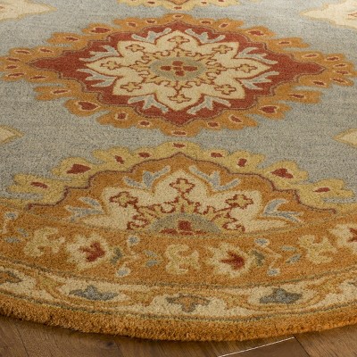 Hand-Tufted Blue and Rust Wool 5' x 8' Area Rug