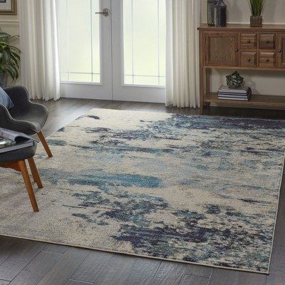 Ivory and Teal Blue Abstract 6' x 9' Synthetic Area Rug