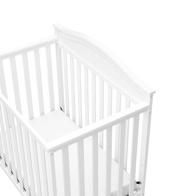 Stella White Pine Wood 4-in-1 Convertible Mini Crib with Foam Mattress