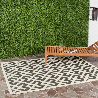 Elysian 31'' Round Black and Beige Synthetic Indoor/Outdoor Rug