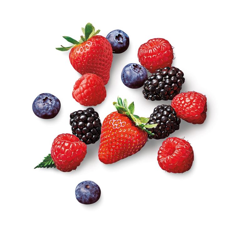 A variety of berries including strawberries, raspberries, blackberries, and blueberries scattered on a white background.