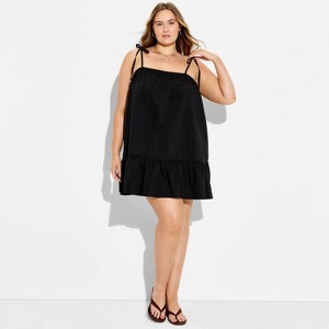 black trapeze mini dress Jacquemus La Mini Robe TrapZe Dress