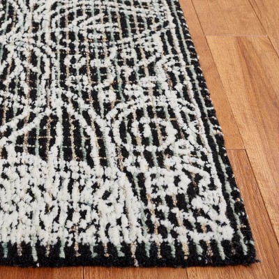 Handmade Black Wool 6' x 9' Tufted Area Rug