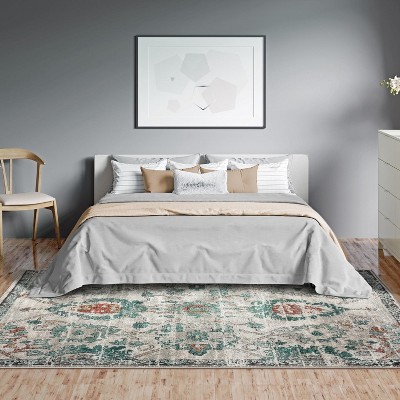 Green Floral Distressed 6' x 9' Synthetic Area Rug