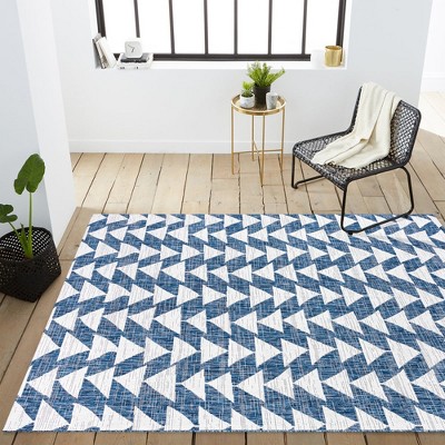 Ivory and Blue Geometric 4' x 6' Synthetic Area Rug