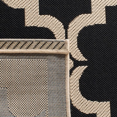 Courtyard Estelle 2'3" x 8' Black/Beige Synthetic Indoor/Outdoor Runner Rug