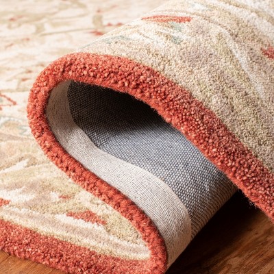 Handmade Floral Elegance Wool Area Rug 6' x 9' in Beige and Rust