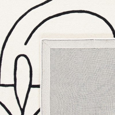 Art Deco Black and Ivory Tufted Wool Area Rug - 3' x 5'