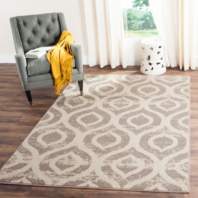 Ivory and Mauve Geometric Low Pile Area Rug