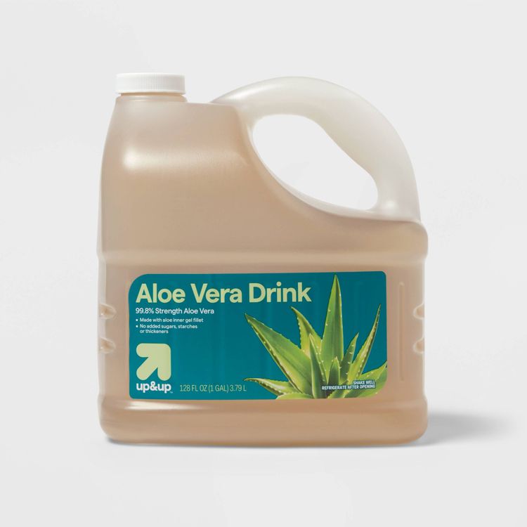 A large jug of Aloe Vera Drink labeled as 99.8% strength aloe vera, with a capacity of 128 FL OZ (1 GAL) / 3.79 L.