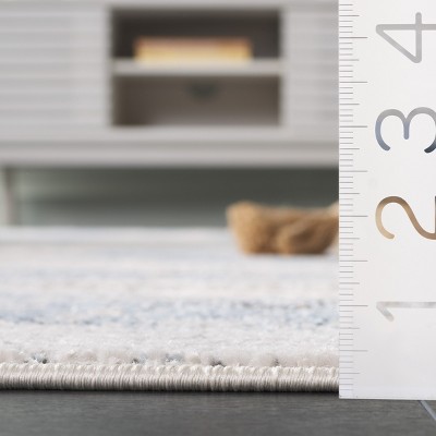 Ivory and Blue Abstract 8' x 10' Synthetic Area Rug