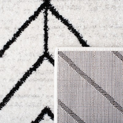 Ivory and Black Geometric 8' x 10' Synthetic Area Rug