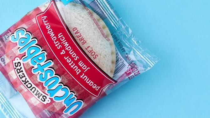 Smucker's Uncrustables Frozen Peanut Butter & Strawberry Jam Sandwich, 2 of 9, play video