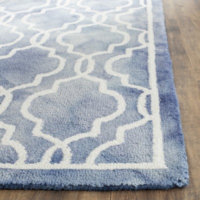Blue and Ivory Tufted Wool 4' x 6' Area Rug