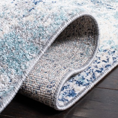 Ivory and Blue Abstract Synthetic Area Rug, 3' x 5'