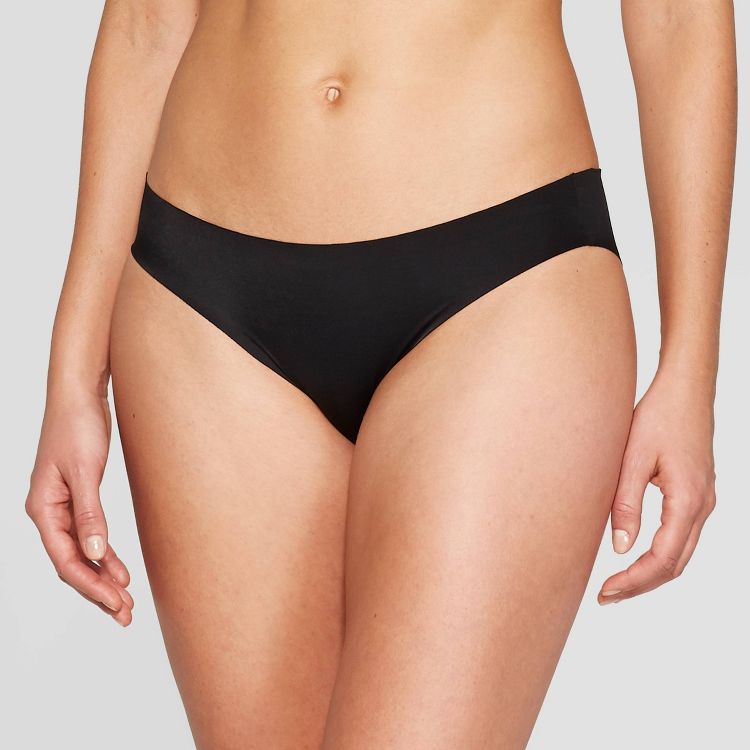 Black colored bikini-style underwear worn by a person.