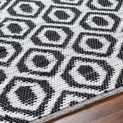 Handmade Black and Ivory Braided Synthetic Area Rug 5' x 7'