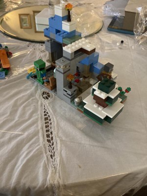 LEGO Minecraft The Frozen Peaks 21243, juego de montaña cueva con Steve,  Creeper, figuras de cabra y accesorios, juguete de bioma ICY para niños de  8