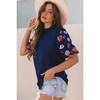 Amaryllis Women's Textured Puff Sleeve Top with Embroidered Details Elegant Relaxed Fit Chic Blouse - 3 of 4