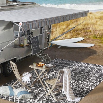 4' x 6' Black and Ivory Synthetic Diamond Pattern Area Rug