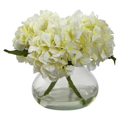 Image of Vase of cream hydrangea flowers