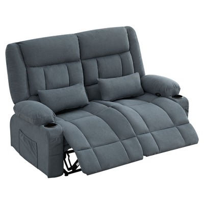 Grey recliner loveseat in a studio setting, fully reclined with cup holders visible