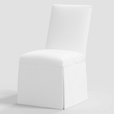 White slipcovered store dining chairs