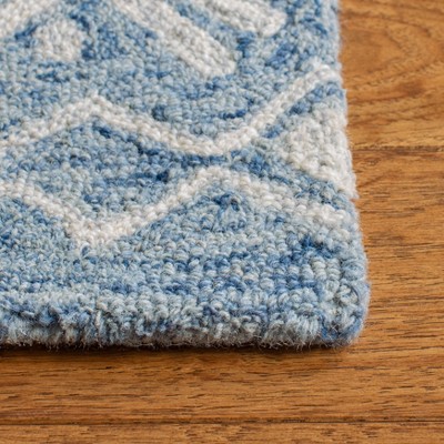 Blue and Ivory Handmade Wool Tufted Area Rug, 5' x 8'