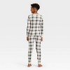 Kids' Plaid Ribbed Long Sleeve Shirt and Pants Holiday Matching Family Pajama Set - Wondershop™ Cream - 2 of 4