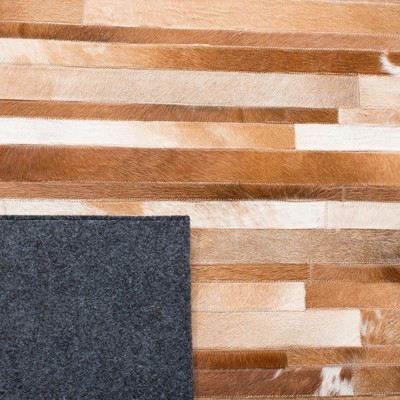 Handwoven Tan and Ivory Geometric Cowhide Area Rug