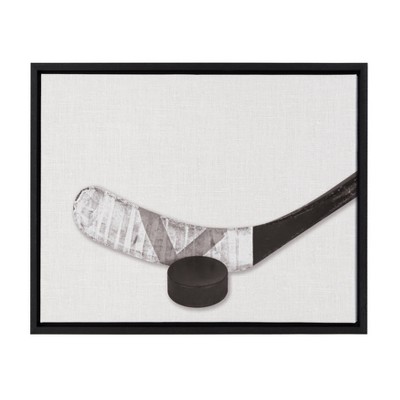 18" x 24" Sylvie Horizontal Hockey Stick And Puck Portrait Framed Canvas Black - DesignOvation