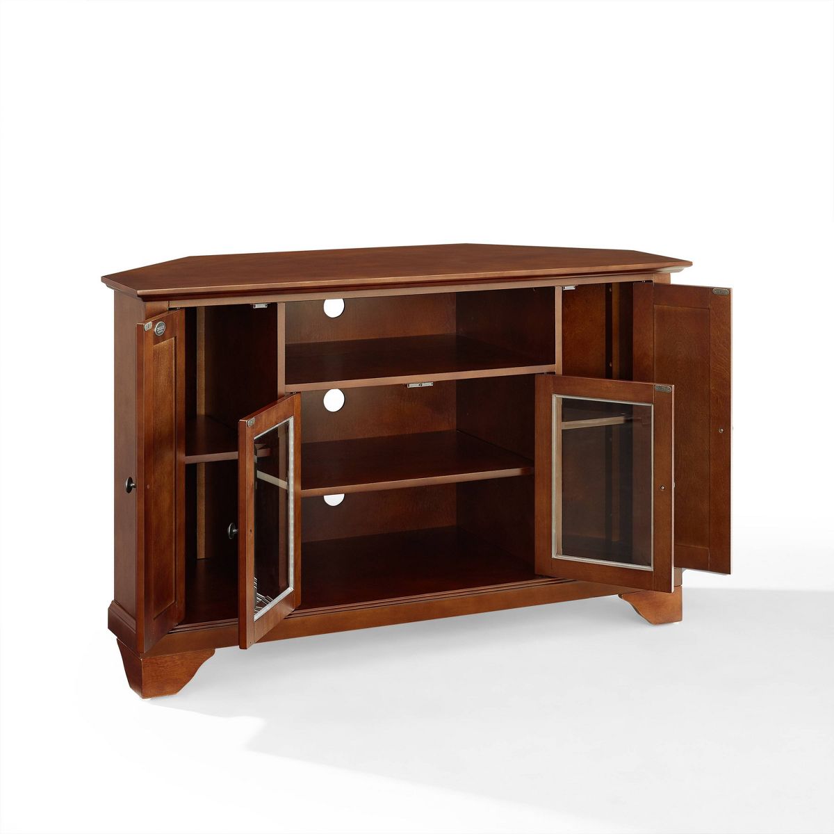 Open cabinet doors on a wooden TV console showing internal shelves